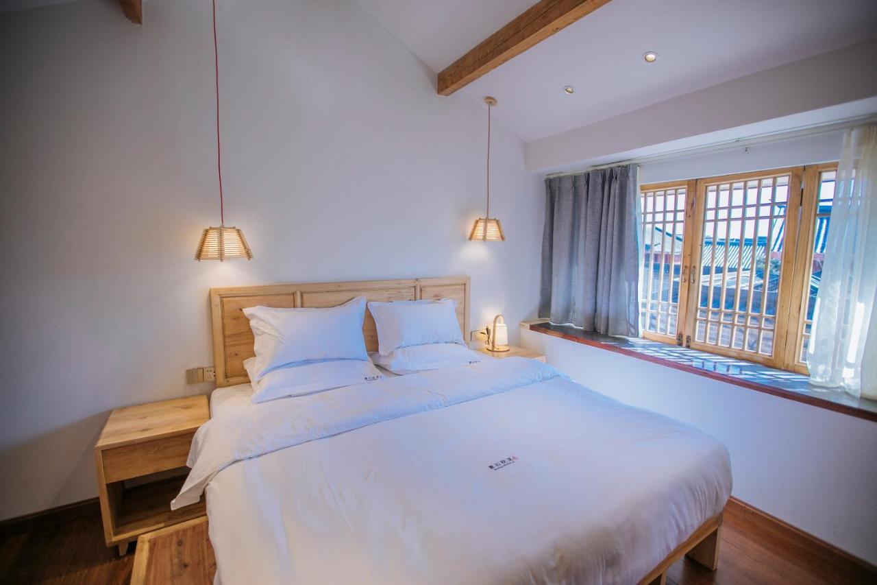 Lijiang Shushi Zhengliu Mujiayuan Hotel Bagian luar foto